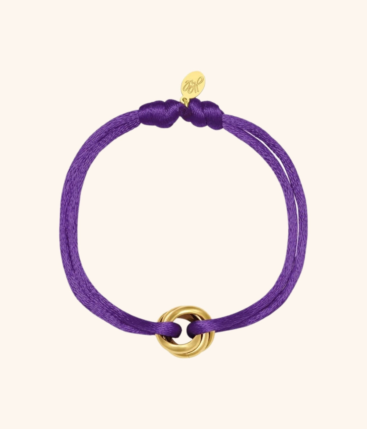 Lila Satin Armband mit goldenem Knoten vor weißem Hintergrund