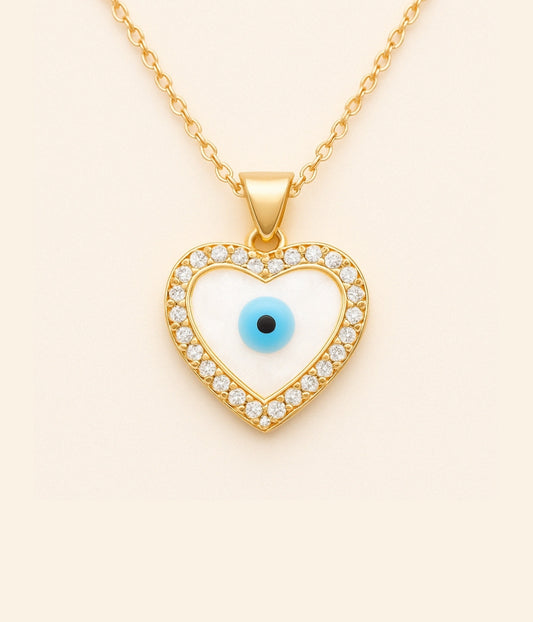 Goldene Kette mit Herzanhänger und blauem Auge – türkisches Auge als Schutzsymbol